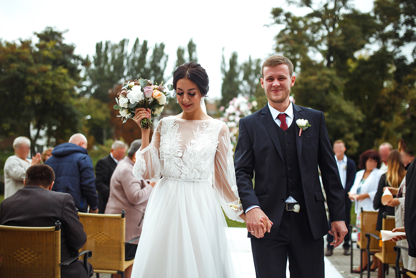 Family throwing rose petals at the newly wed bride 2022 12 16 00 29 33 utc 1.jpg