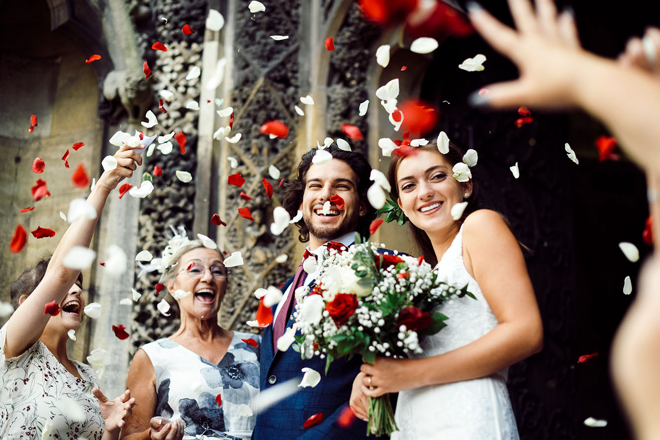 Family throwing rose petals at the newly wed bride 2022 12 16 00 29 33 utc.jpg